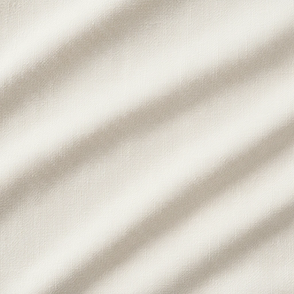Țesătură de bumbac organic de culoare deschisă, cu o textură fină și uniformă, sugerând confort și naturalețe.